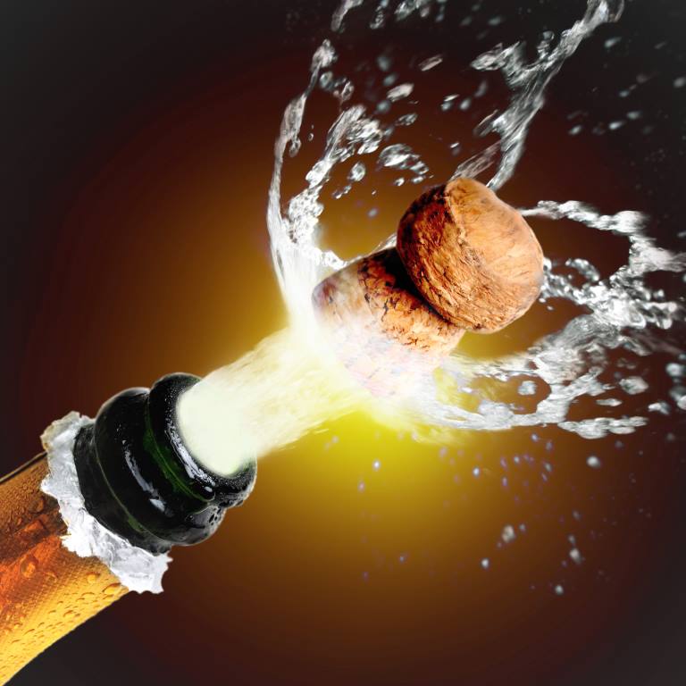 Close up of champagne cork popping